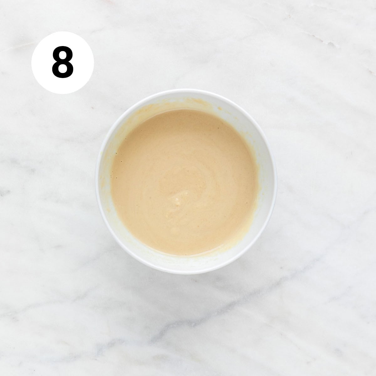 Lemon tahini dressing in a bowl.
