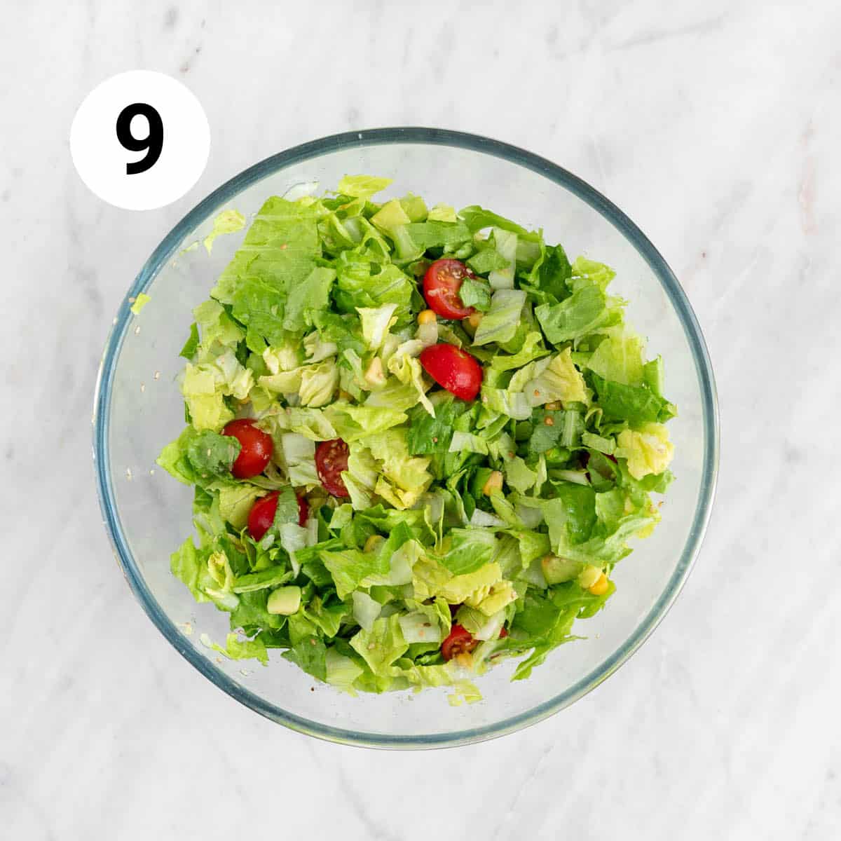 Salad veggies in a large bowl.