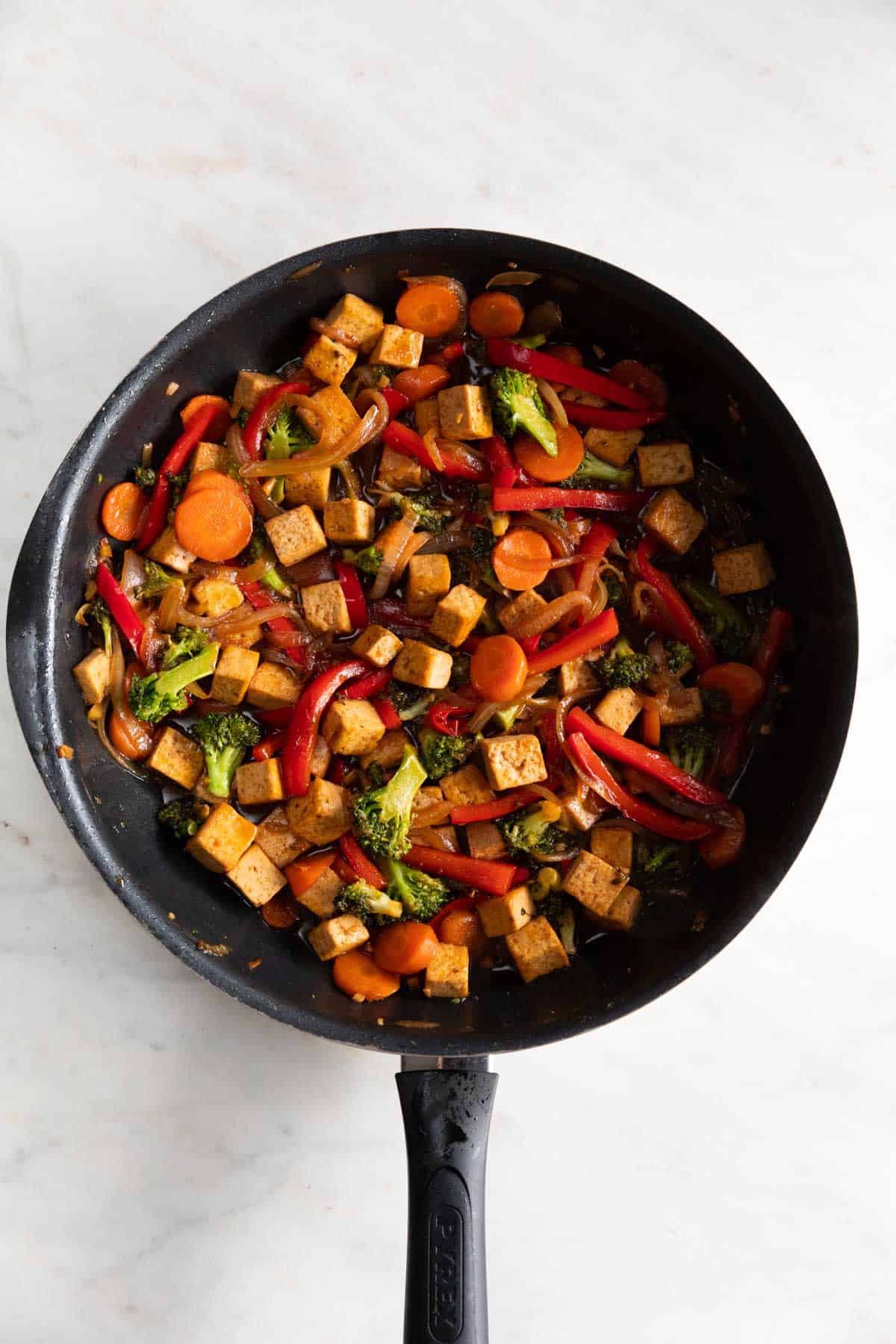 Tofu stir fry in a skillet.
