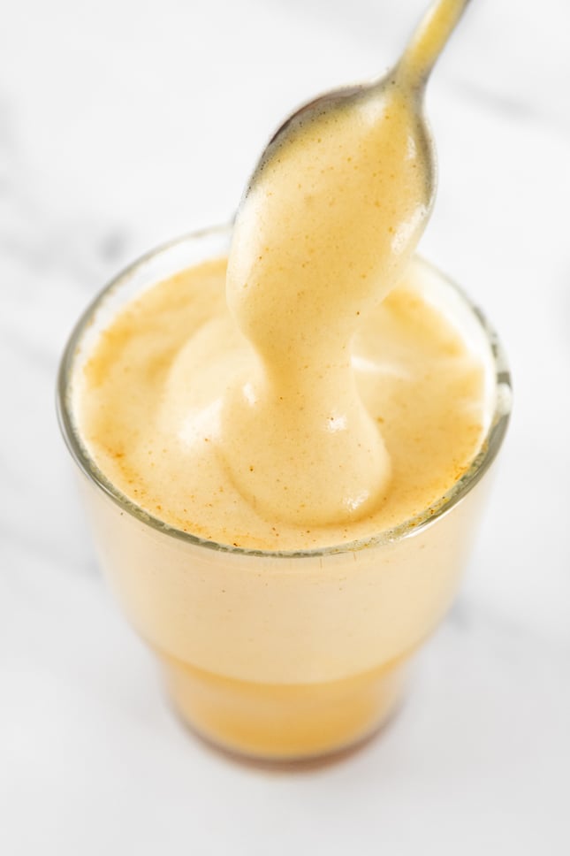 Photo of a cup of turmeric latte taken from above