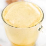Photo of a cup of turmeric latte with the words turmeric latte