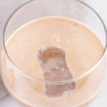 Photo of a glass of vegan Baileys with a title