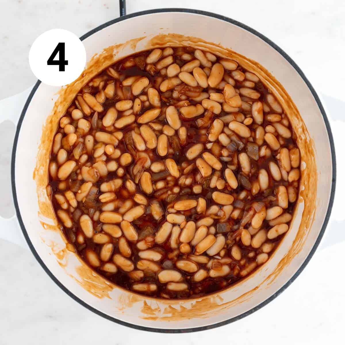 Vegan baked beans ingredients mixed in a pot.