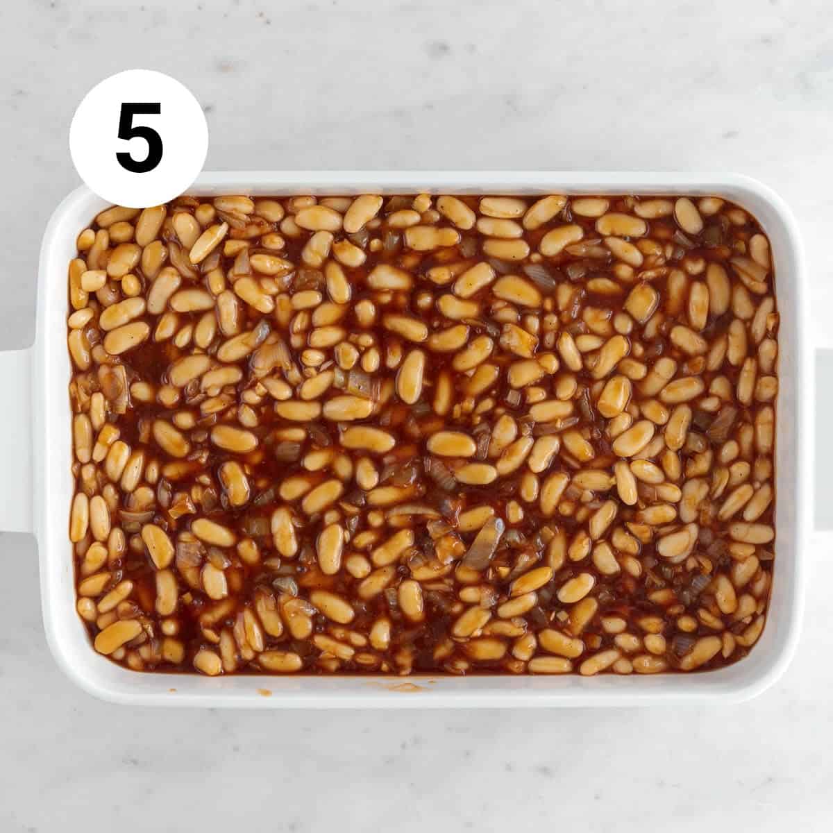 Vegan baked beans in a casserole dish before baking.