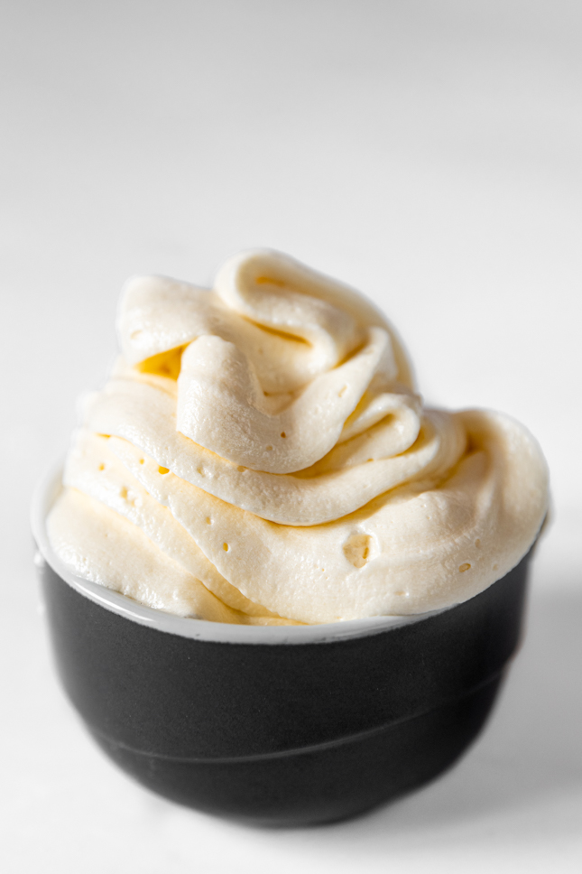 Photo of a bowl of vega buttercream frosting