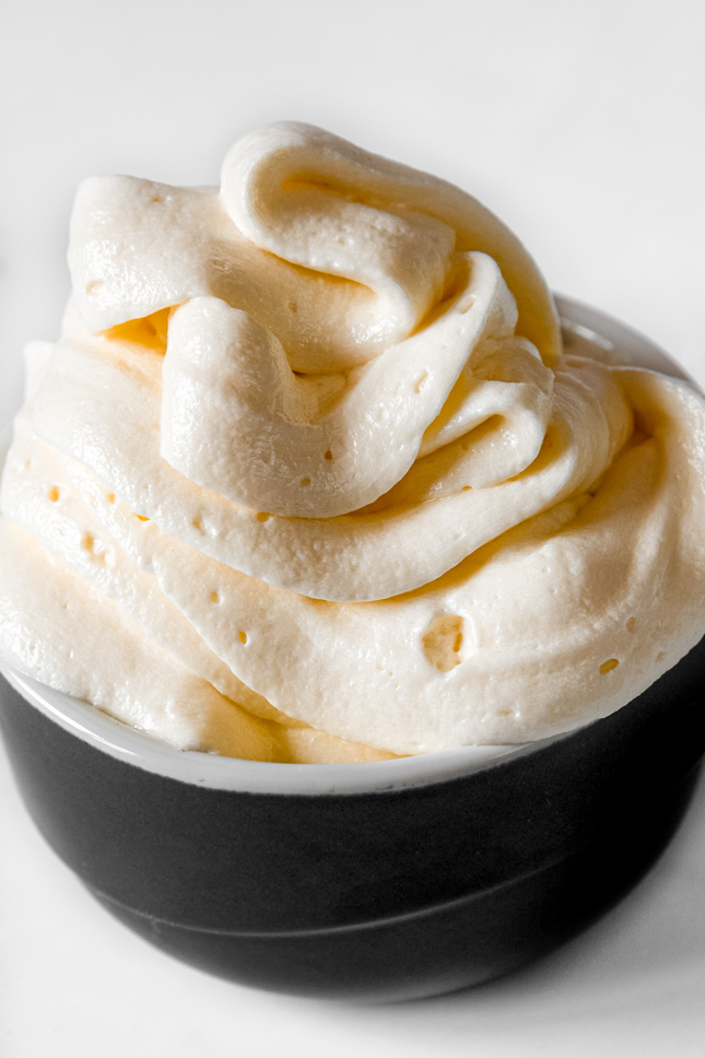 Side shot of a bowl of vegan buttercream frosting