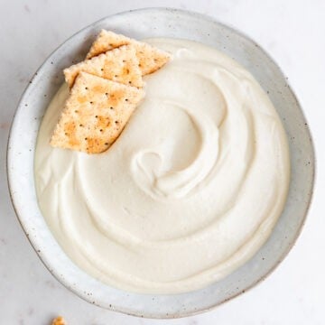 Vegan cashew cheese in bowl with crackers.