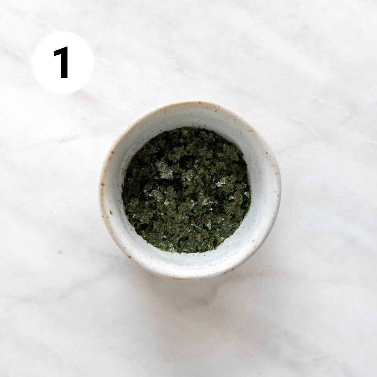 Nori flakes in a small bowl.