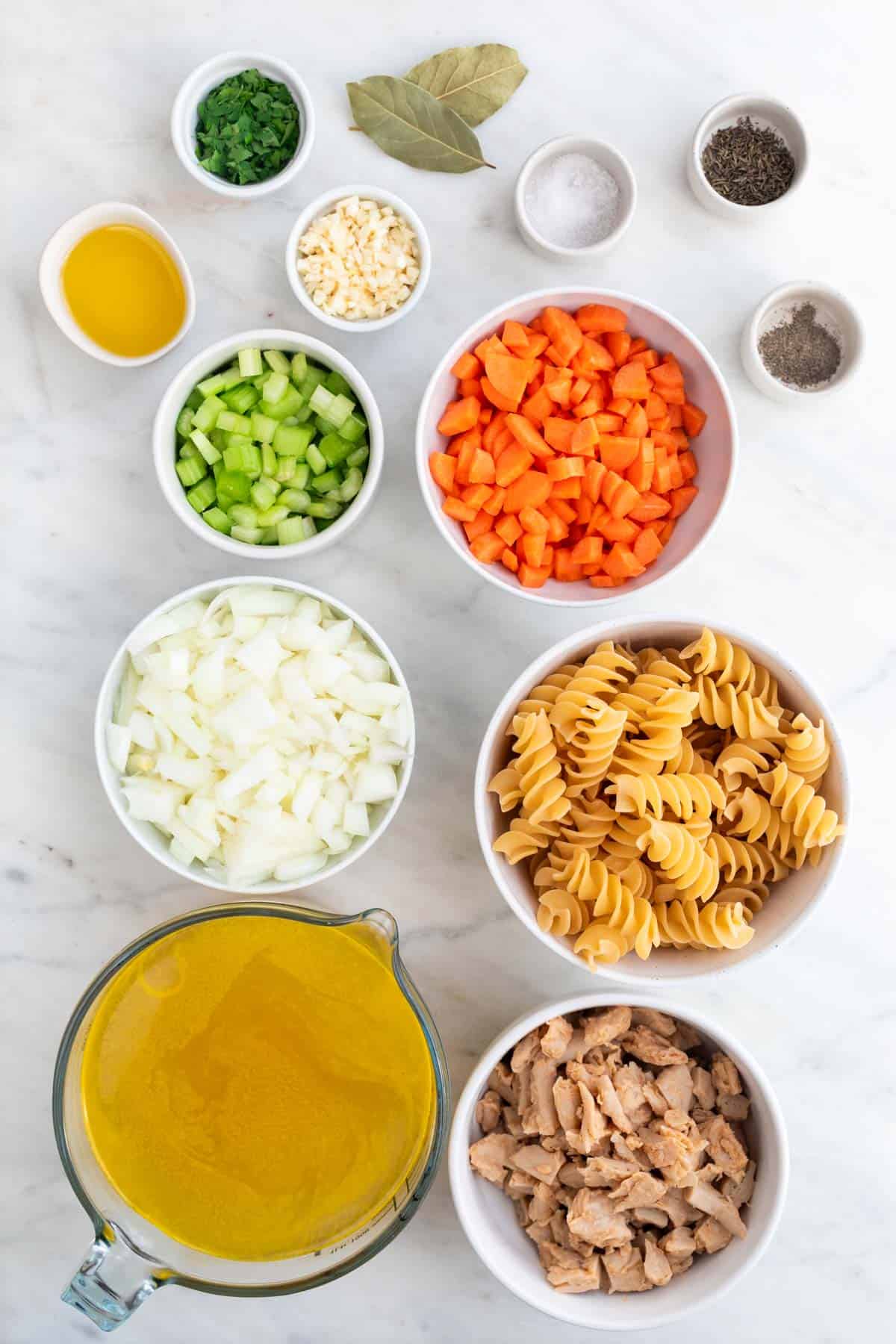 Ingredients for making vegan chicken noodle soup.