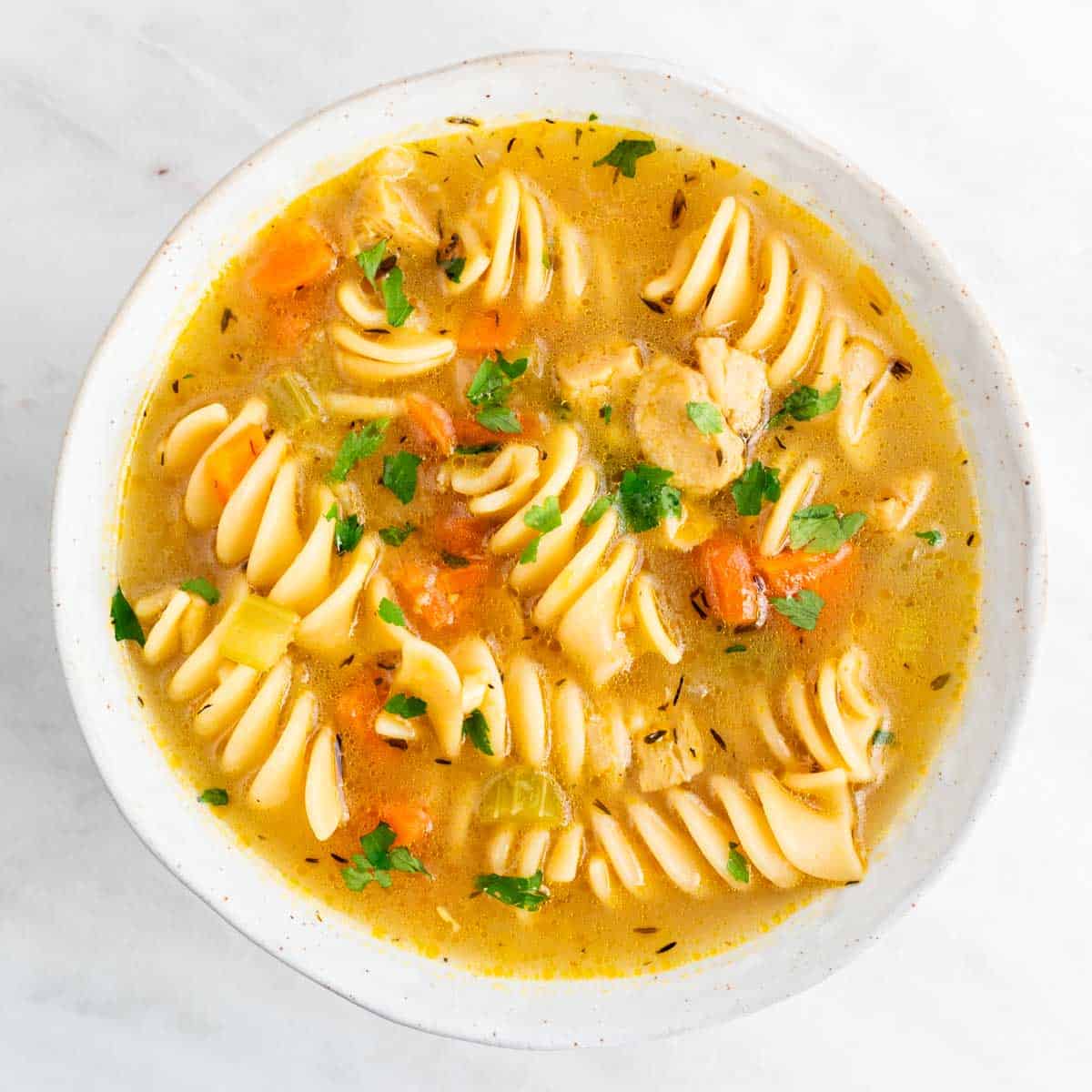 Vegan chicken noodle soup in a dish.