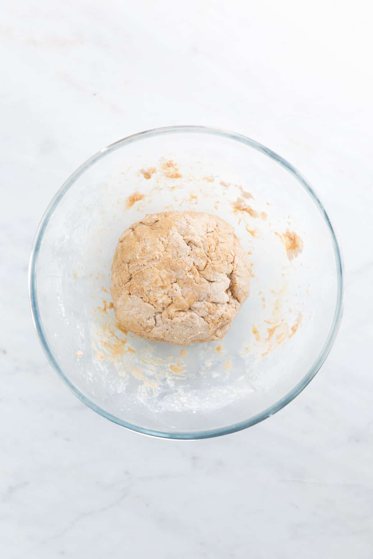 A ball of dough in a large bowl.