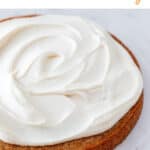 A vegan cake topped with vegan cream cheese frosting.