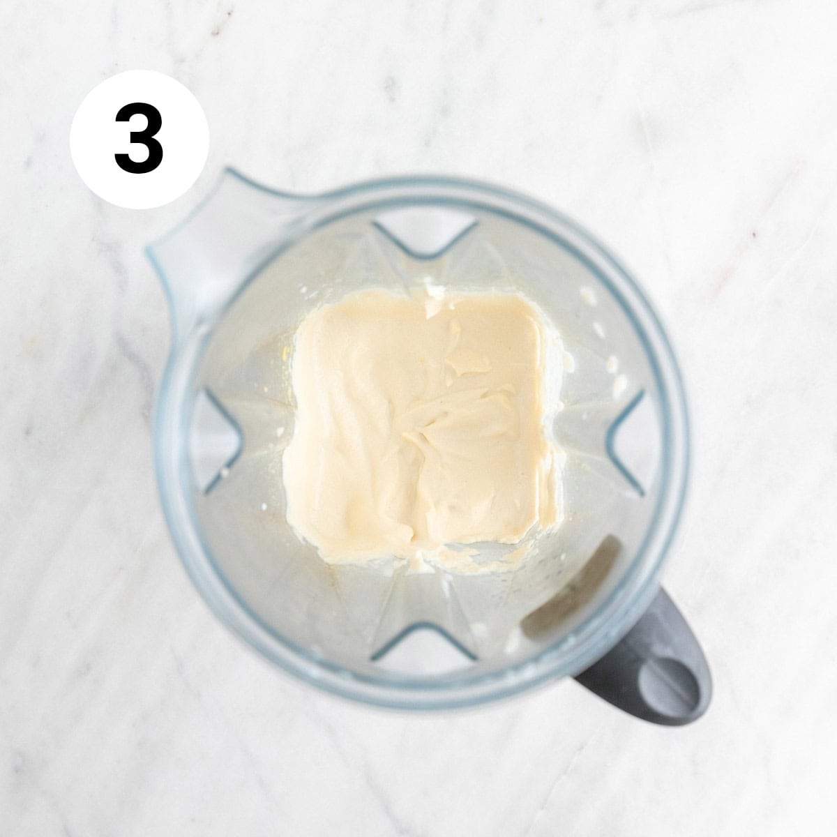​​Vegan cream cheese in a blender jar.