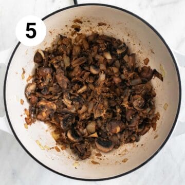 Mushrooms, garlic, onion, wine, and flour cooked in a large pot.