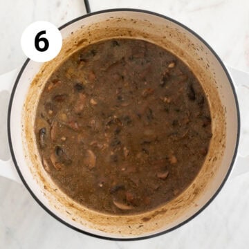 Cooked vegan cream of mushroom soup in a pot before adding coconut milk.