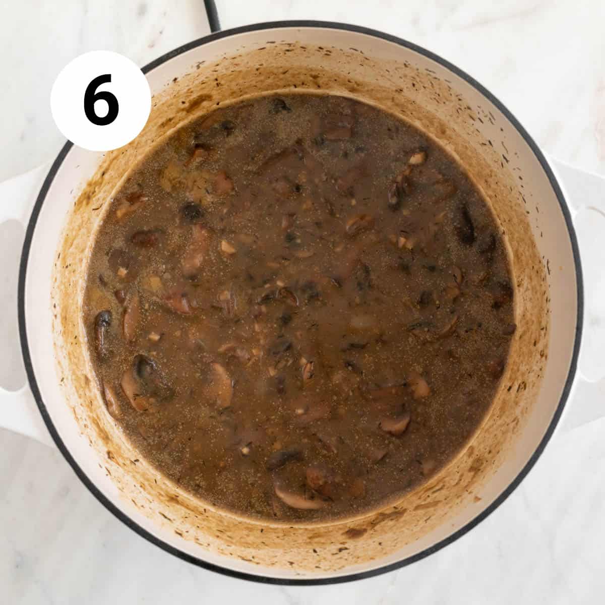 Cooked vegan cream of mushroom soup in a pot before adding coconut milk.
