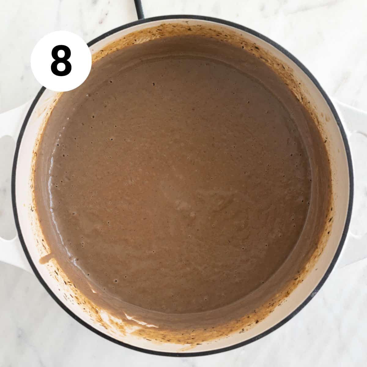 Blended vegan cream of mushroom soup in a pot.