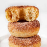 Side photo of a pile of vegan donuts with a heading