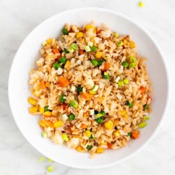 Vegan fried rice in shallow serving dish.