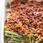 Vegan green bean casserole baked in a baking dish.