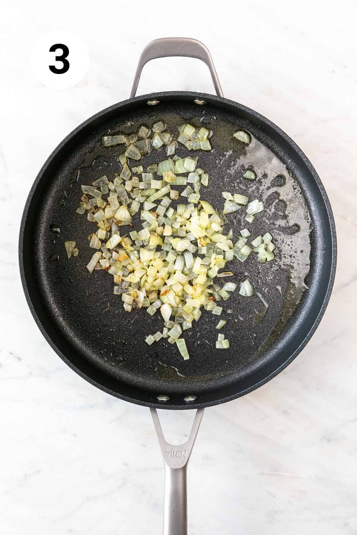 Onion sautéed in a skillet.