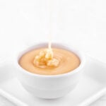 Photo of a bowl of vegan icing with some letters