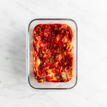 Vegan kimchi in a glass container.