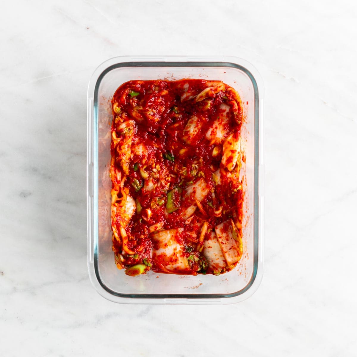 Vegan kimchi in a glass container.
