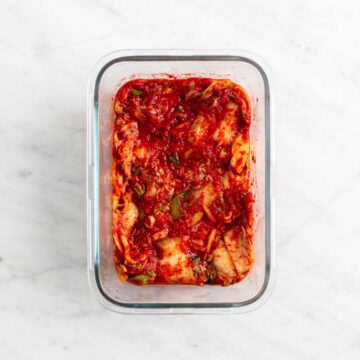 Vegan kimchi in a glass container after fermenting.