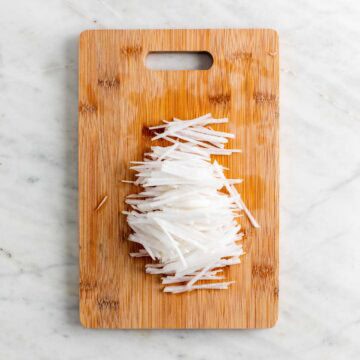 Korean radish sliced into matchstick-sized pieces.