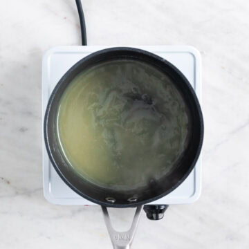 Rice porridge in a saucepan on the stove.