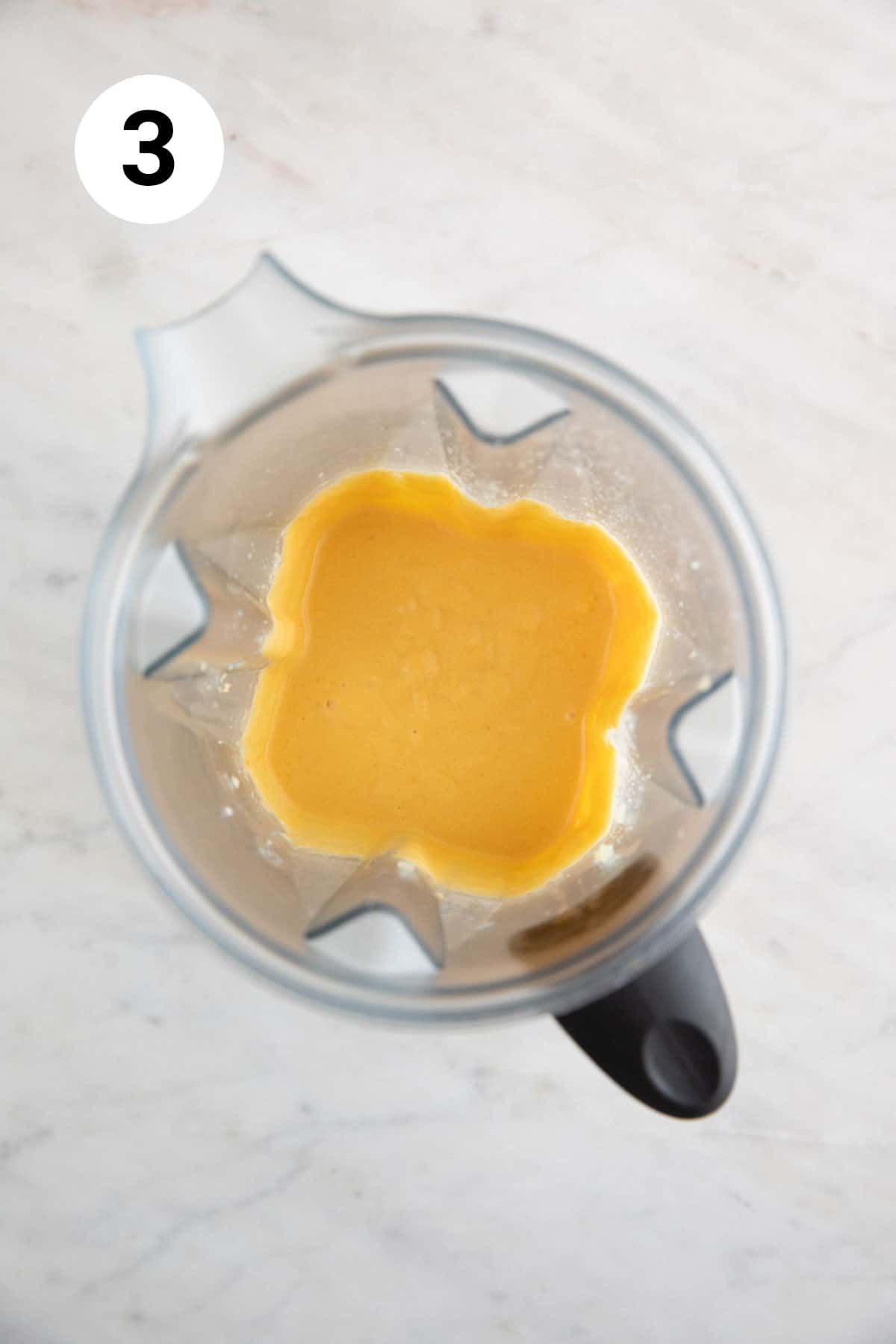 Vegan cheese sauce blended in a blender.