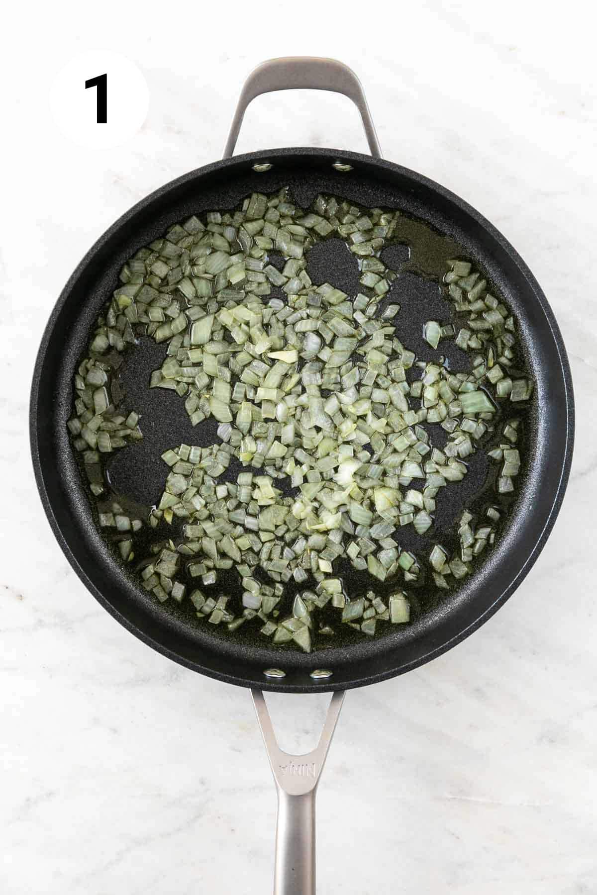 Sautéed onion in oil in a skillet.