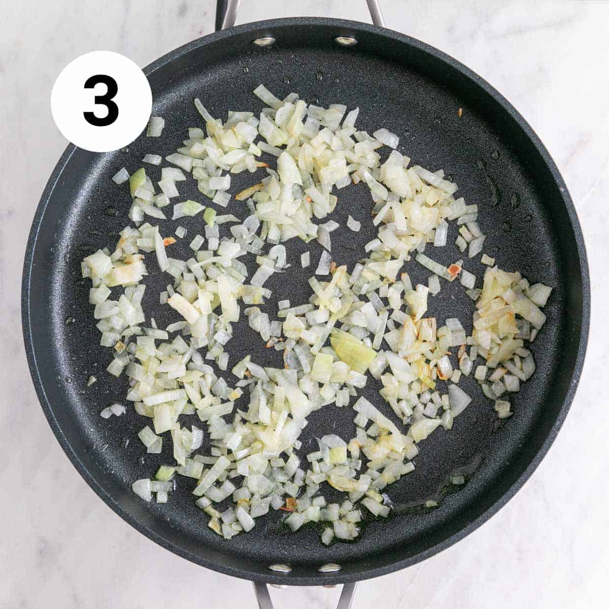 Sautéed onion in oil in a skillet.