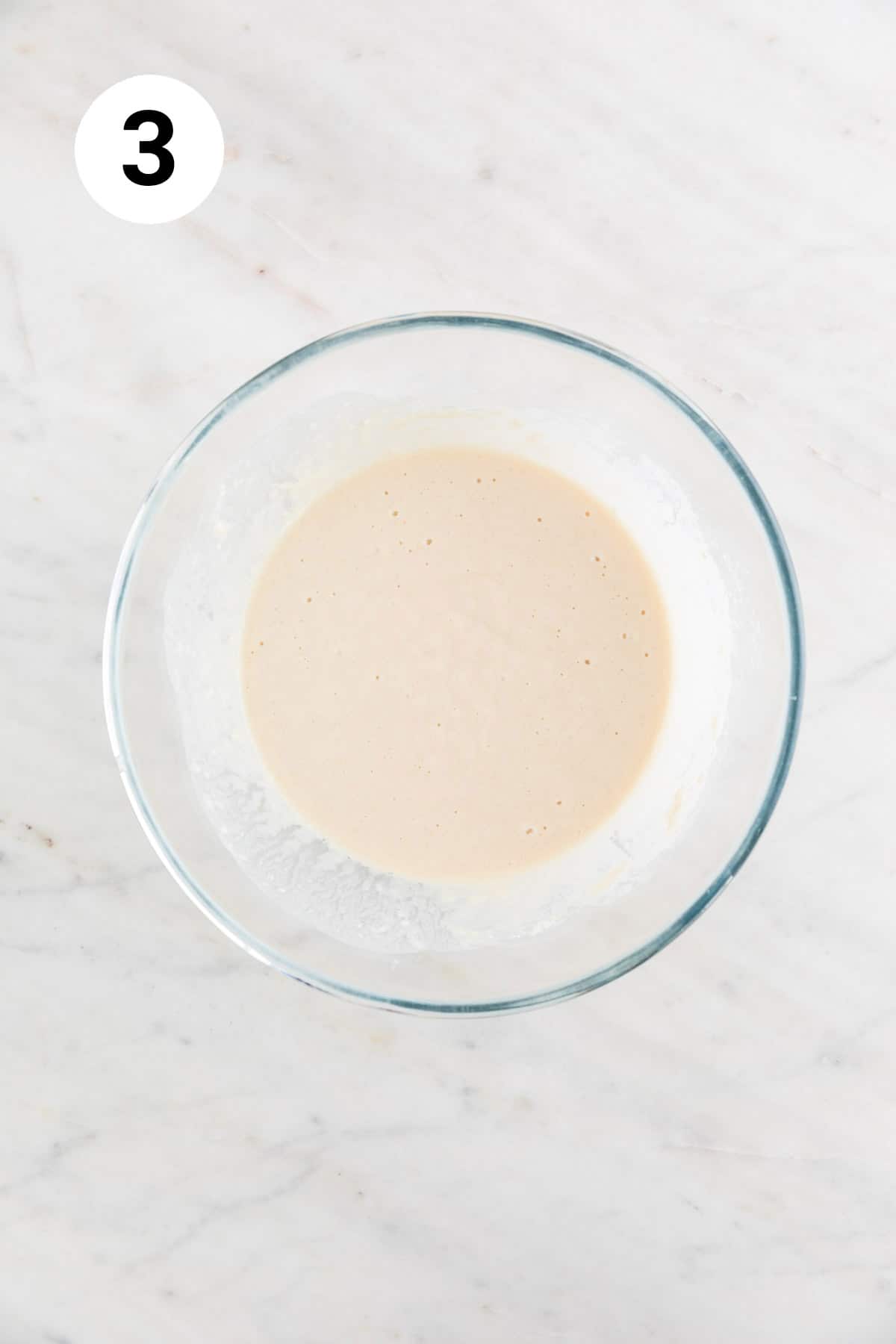 Vegan pancake batter in a large mixing bowl.