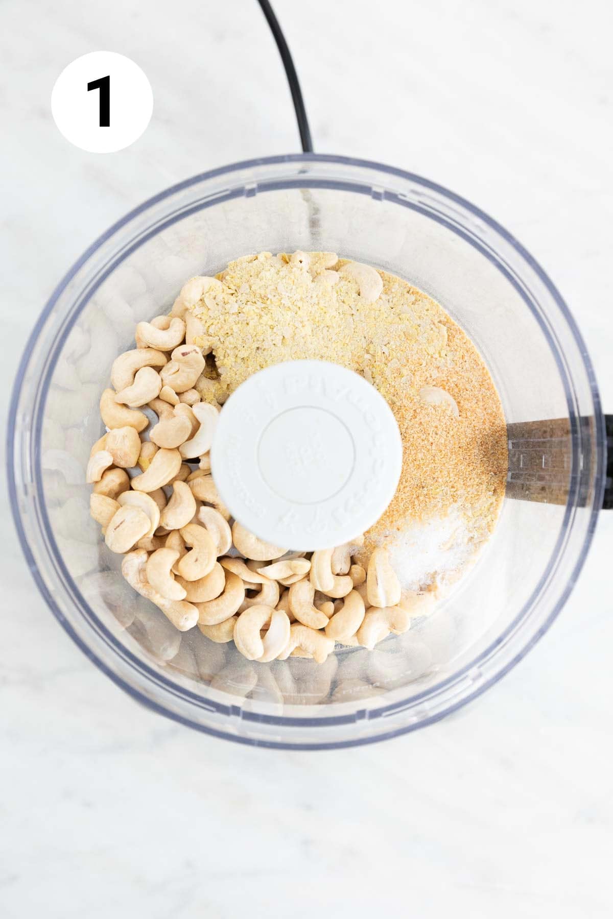 Food processor with ingredients before pulsing.
