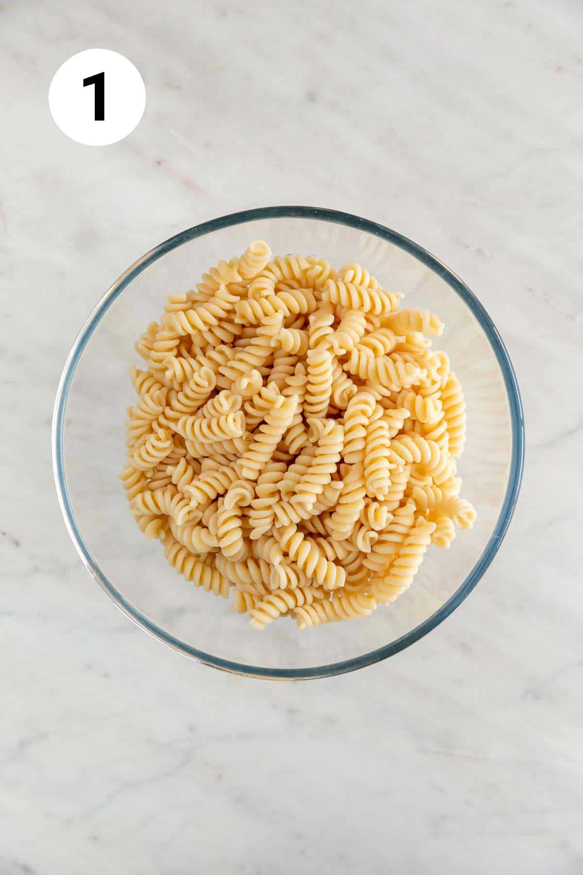Bowl of cooked fusilli pasta.
