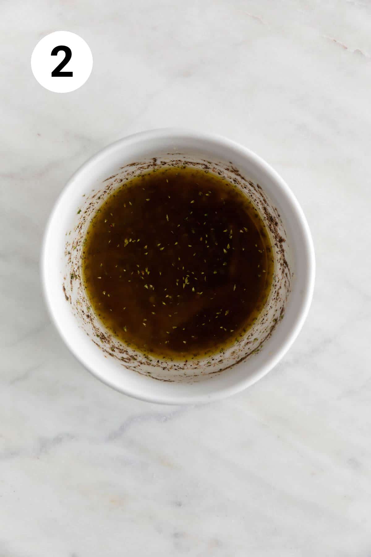 Small mixing bowl with dressing.