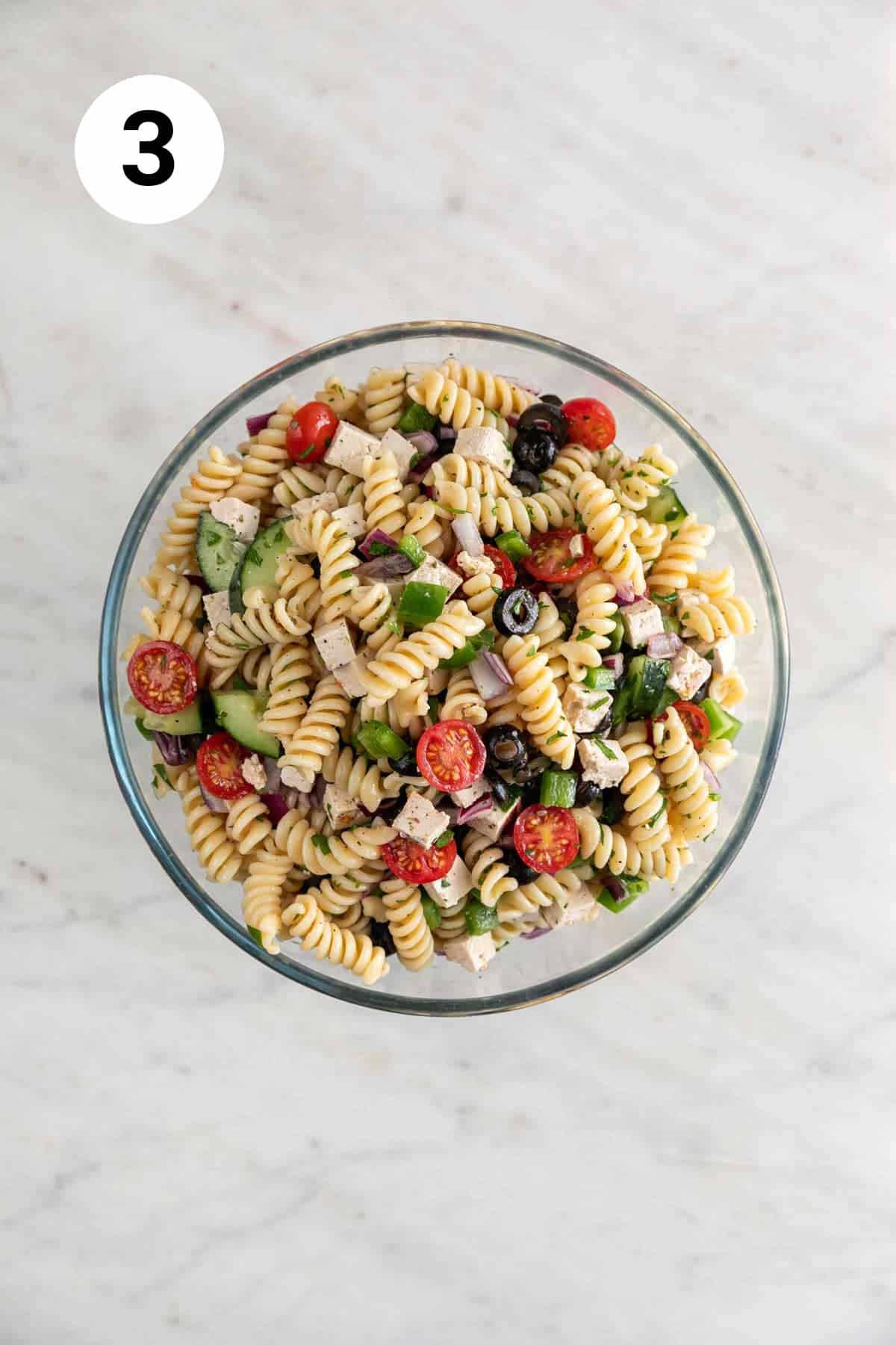 Vegan pasta salad in a large mixing bowl.