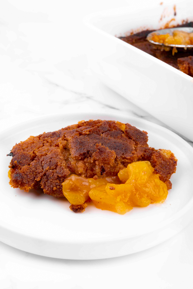 Photo of some vegan peach cobbler on a plate