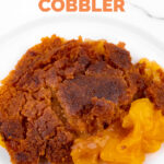 Close-up photo of some vegan peach cobbler with a heading