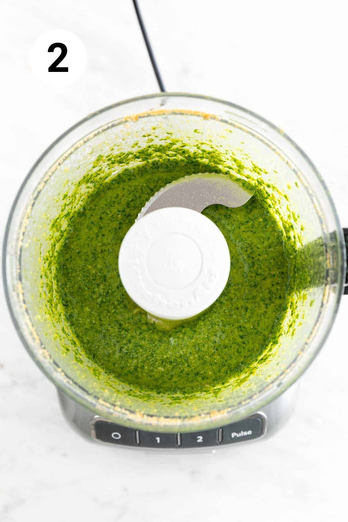 Finished vegan pesto in a food processor.
