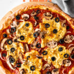 Photo of a vegan pizza with the words vegan pizza