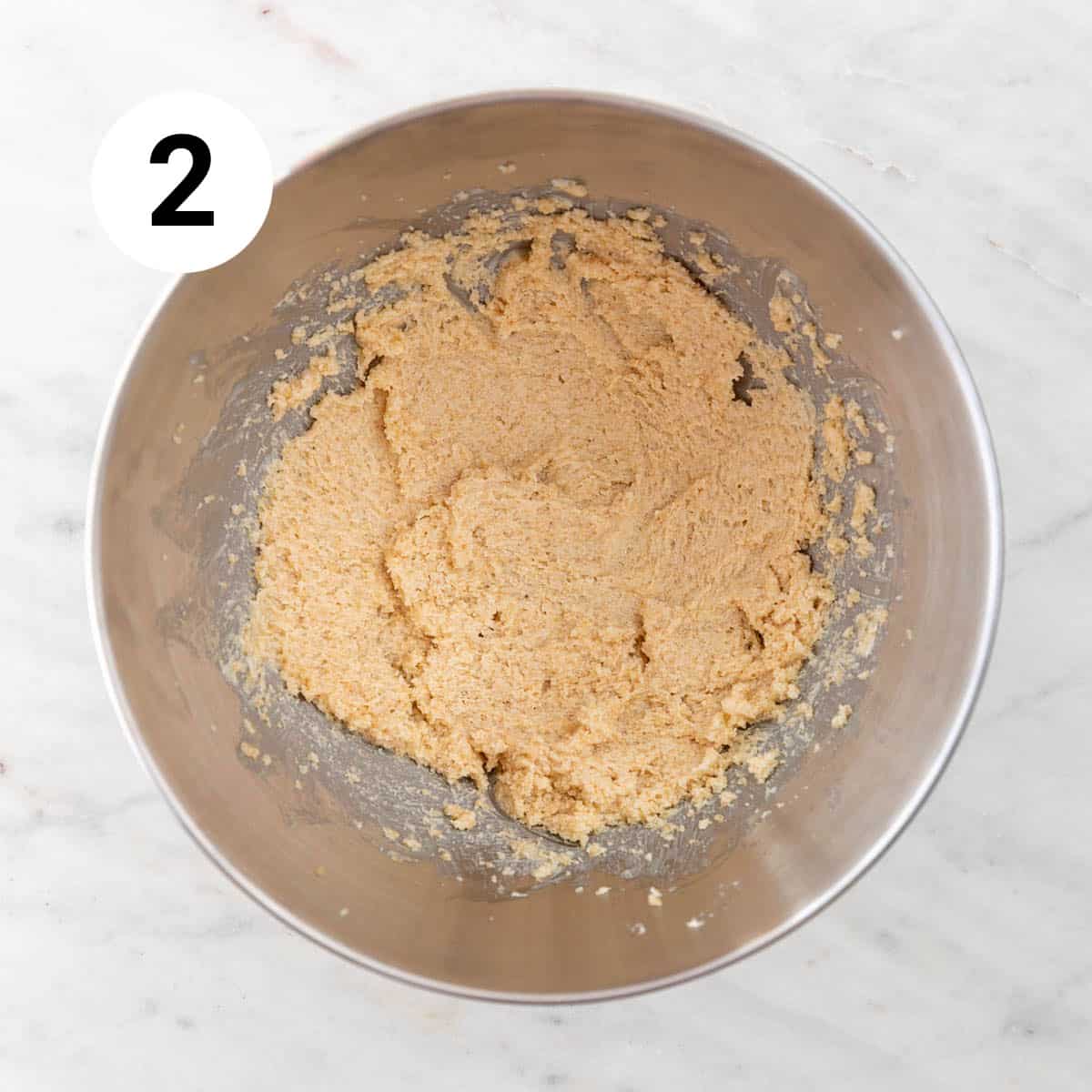 Vegan butter, granulated sugar, and brown sugar beaten in a stand mixer bowl.