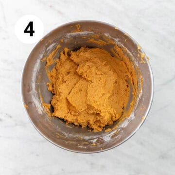 Vegan pumpkin cookie dough in a stand mixer bowl.