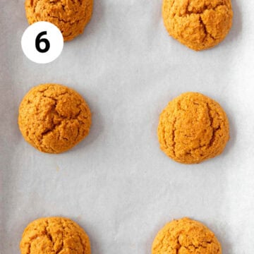 Baked vegan pumpkin cookies onto a lined baking sheet.