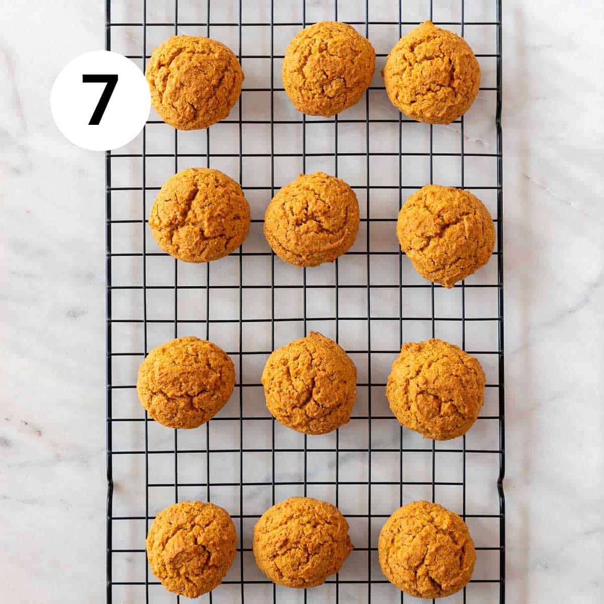 Baked vegan pumpkin cookies onto a cooling rack.
