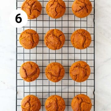 Baked vegan pumpkin muffins on a cooling rack.