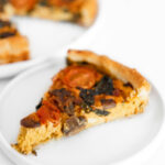 Square photo of a slice of vegan quiche