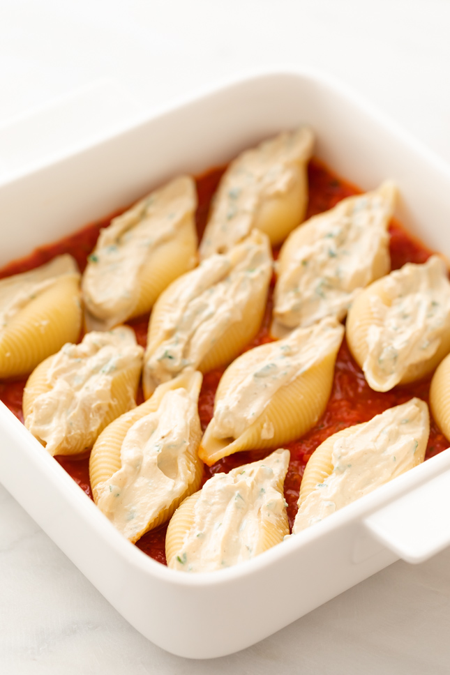Photo of some vegan stuffed shells in a baking dish